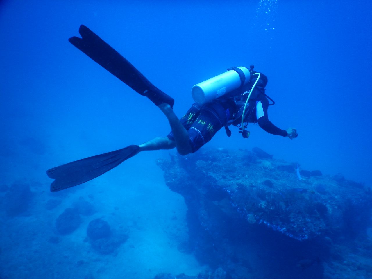 Scuba diver exploring underwater depths, capturing marine adventure vibes.